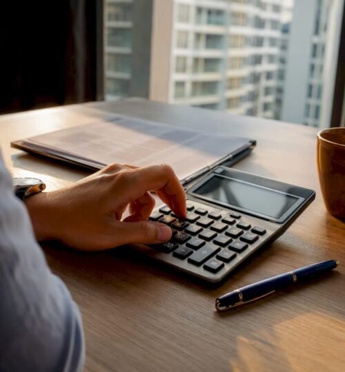 Borrower calculating mortgage affordability at home